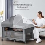 Berço de bebê 4 em 1, embale e brinque, berço de cabeceira, trocador de fraldas – Vem com colchão, mosquiteiro, armazenamento inferior e barra de brinquedo para recém-nascidos e crianças
