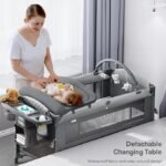 Berço de bebê 4 em 1, embale e brinque, berço de cabeceira, trocador de fraldas – Vem com colchão, mosquiteiro, armazenamento inferior e barra de brinquedo para recém-nascidos e crianças